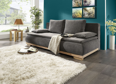 Schlafsofa mit Bettkasten und Kissen
