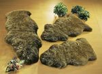 Bettumrandung aus echtem Lammfell in Tierform BRAUN