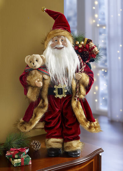 Weihnachtsmann mit Geschenkesack und Teddy 