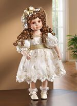Porzellanpuppe mit festlicher Kleidung 