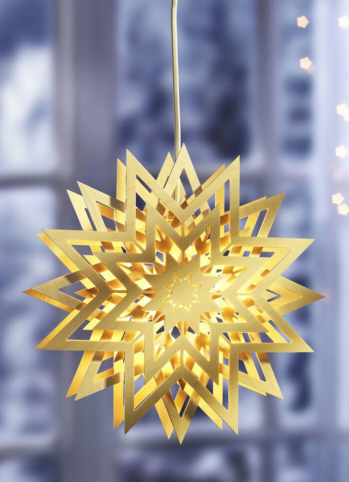 Beleuchteter Fensterstern aus dem Erzgebirge