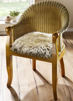 Merino-Lammfell-Sitzauflage in Tierform SAND