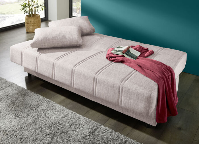 Frei im Raum aufstellbares Schlafsofa mit Dekokissen und Bettkasten CREME